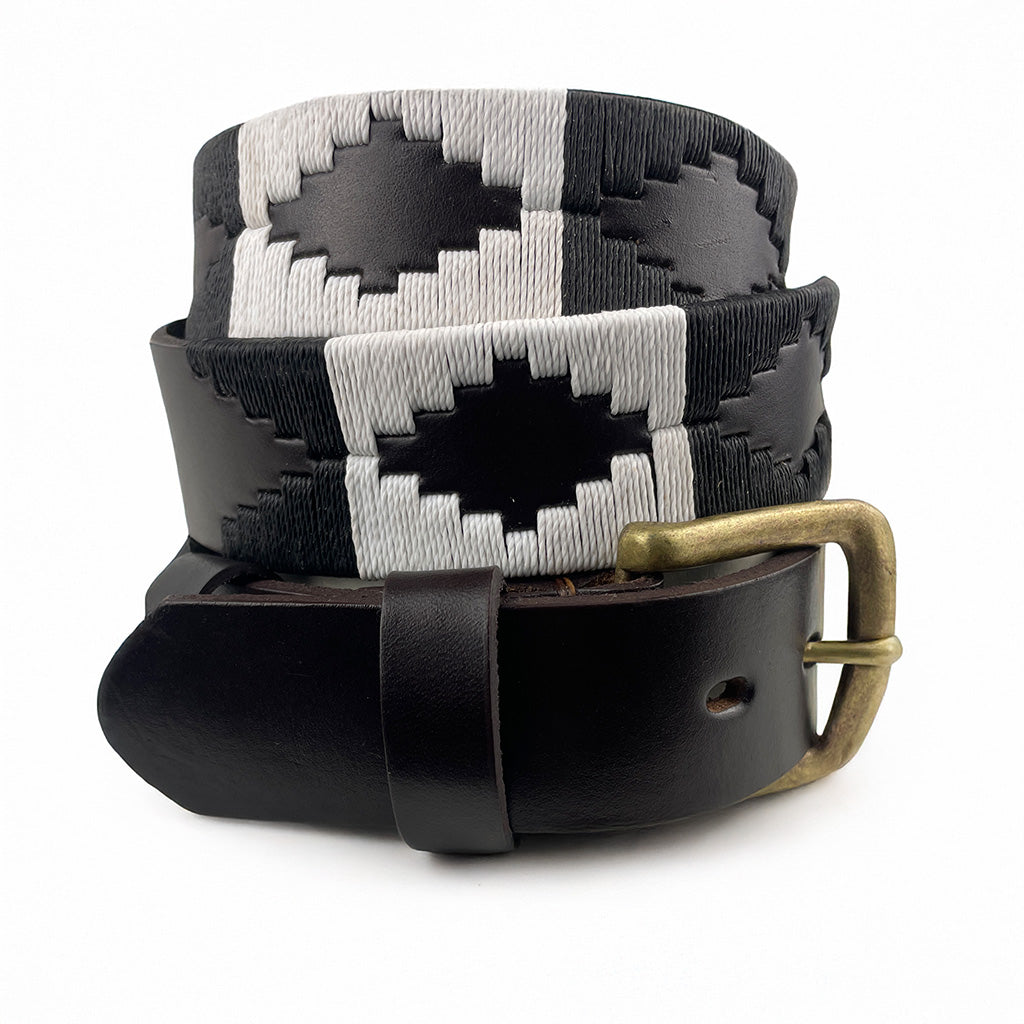 Handcrafted leather polo belt with Black & White thread embroidery and bronze buckle, by Camperos